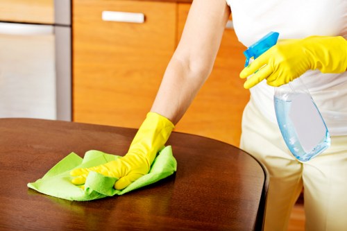 Cleaner maintaining a communal lobby in a Chelsea building